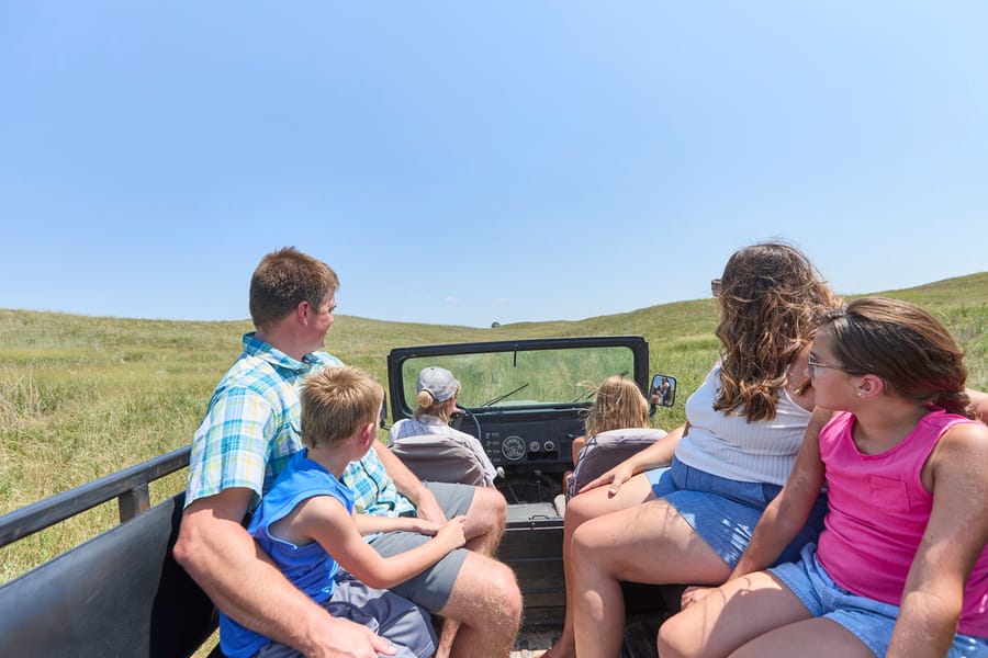 Calamus Outfitters_Family in Open Top Truck_Clay Cook Shoot 2024