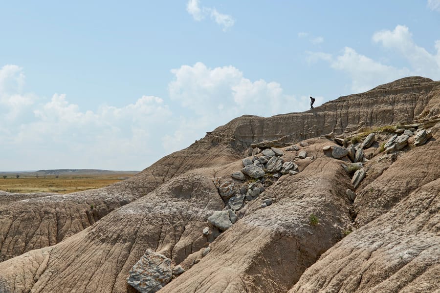 Toadstool Geological Park_Hiker_Clay Cook Shoot 2024