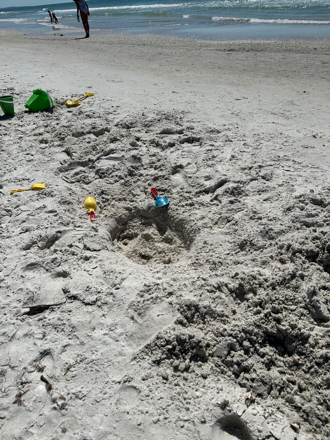 Hole in the Sand on the beach