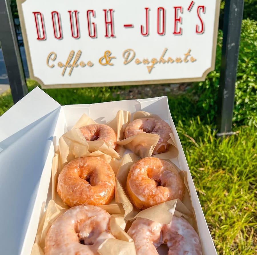 Dough-Joe's sign and doughnuts in a box