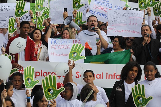 Evangelical Christians protest against child sex exploitation outside World Cup Stadium in Sao Paulo