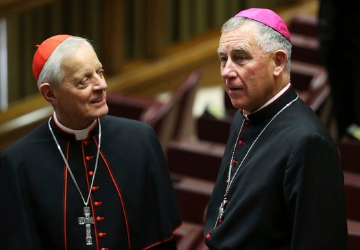 Bishop John Atcherley Dew and cardinal Donald William Wuerl speak before Pope Francis leads a consistory at the Vatican