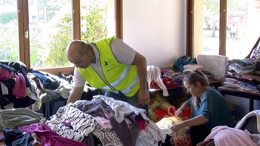 WEB volunteers sorting clothes for refugees outside Paris