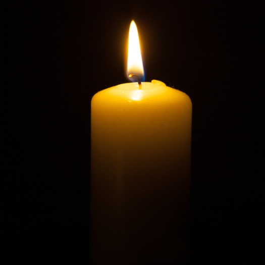 one candle black background