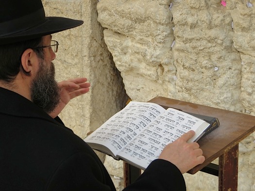 Man praying at western wall