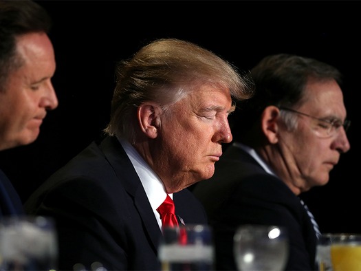 WEB U.S. President Donald Trump prays during the National Prayer Breakfast event in Washington, U.S.