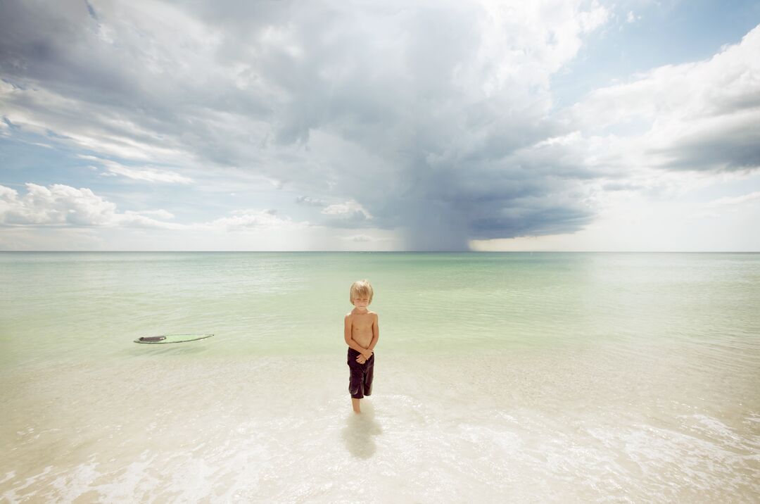 Boy waiting in the water at AMI