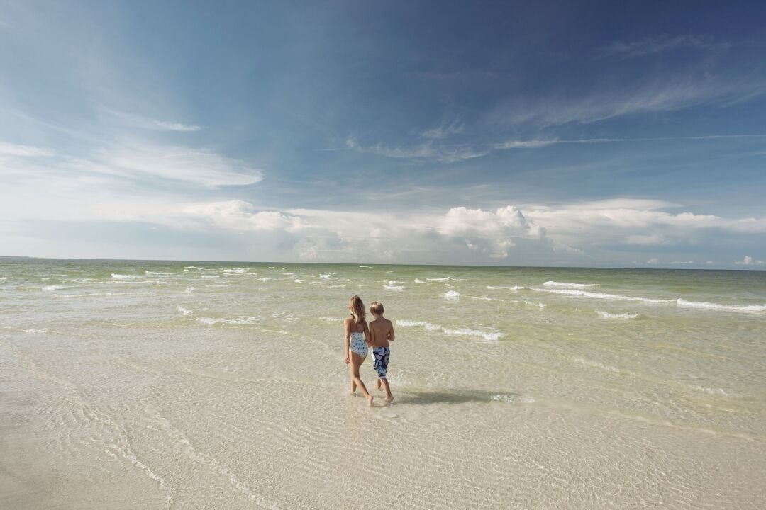 KIDS WALKING THE BEACH AT AMI