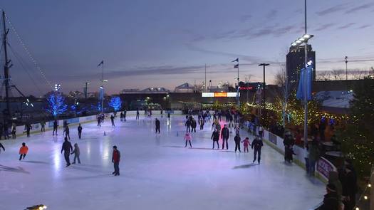 Winterfest - Travel left, aerial - Skaters on rink