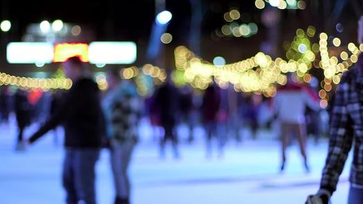 Winterfest - rack focus, tight on skaters in rink