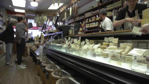 Di Bruno Bros. cheese monger serving customers