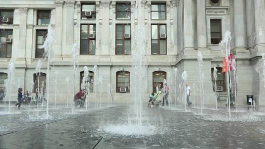 Dilworth Park Fountain, family walking