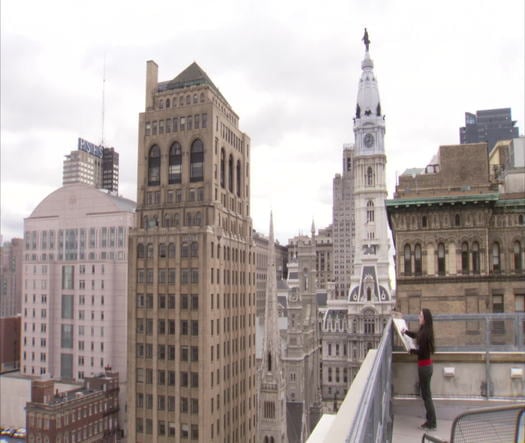 Pennsylvania Academy of the Fine Arts, student painting on roof with City Hall in background