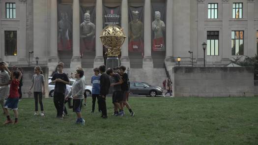 Police Officers Playing Catch with Kids Outside The Franklin Institute