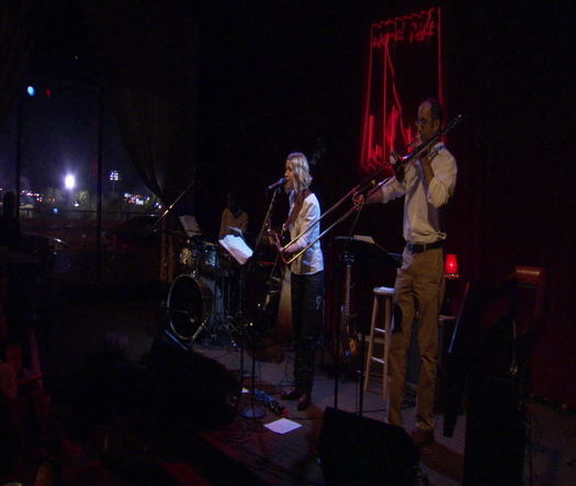 World Café Live Wide shot of performer (Kate Schutt) and her band