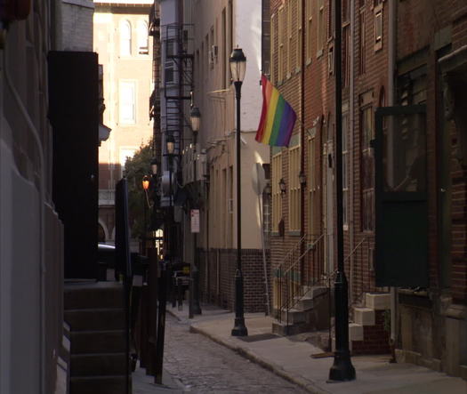 Gayborhood rainbow flag waving