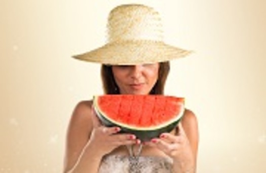 Woman in bikini holding a watermelon