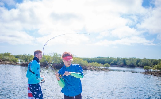 Ms. Kim and Son fishing with friends