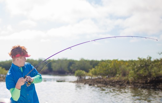 Ms. Kim and Son fishing with friends