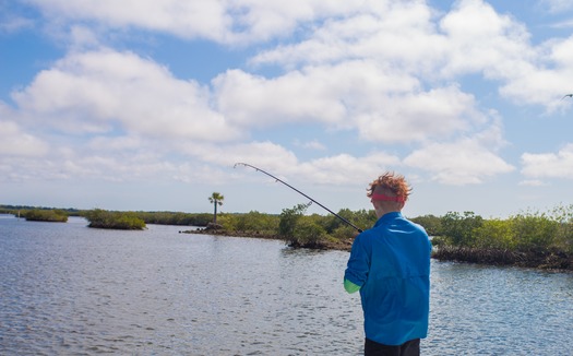 Ms. Kim and Son fishing with friends