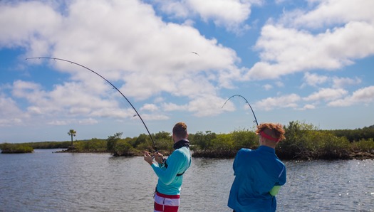 Ms. Kim and Son fishing with friends
