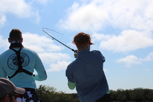 Ms. Kim and Son fishing with friends