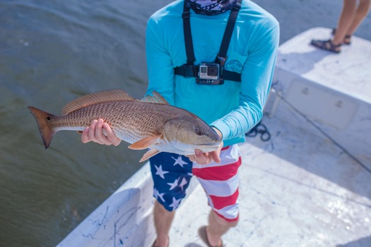 Ms. Kim and Son fishing with friends