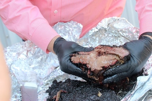 Brisket in Hands_Jalapeno Bucks_Kat Peterson