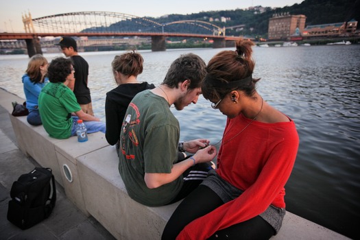 Students Gather by the Riverside