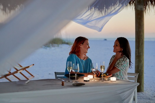 LGBT Couple Dining on Marco Island Beach at Sunset