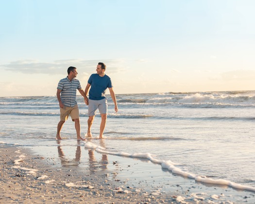 LGBT Couple Walking On Marco Island Beach