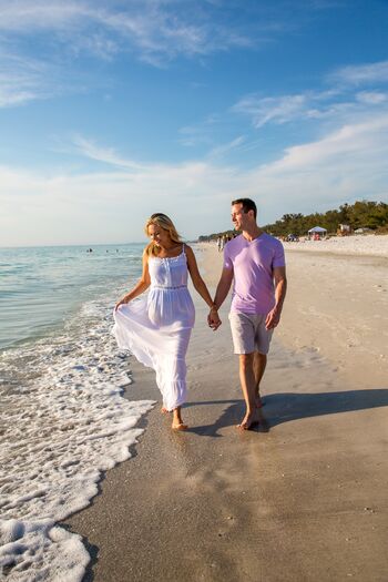 Couple Walking Shoreline at Anna Maria Island