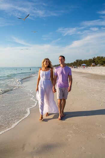 Couple Walking Shoreline at Anna Maria Island