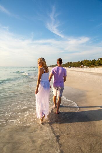 Couple Walking Shoreline at Anna Maria Island