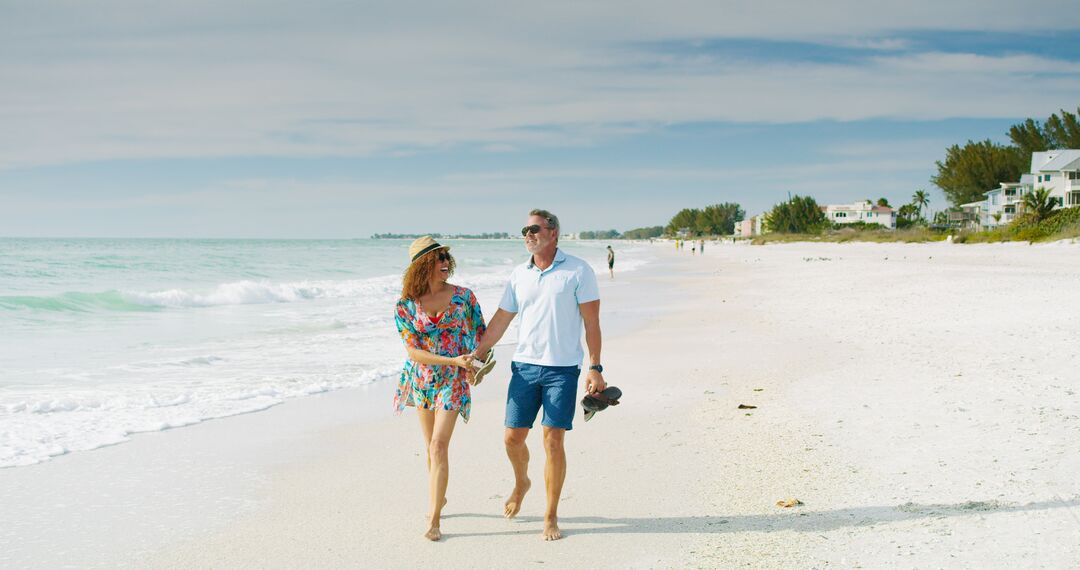 Couple Walking Shoreline at Anna Maria Island