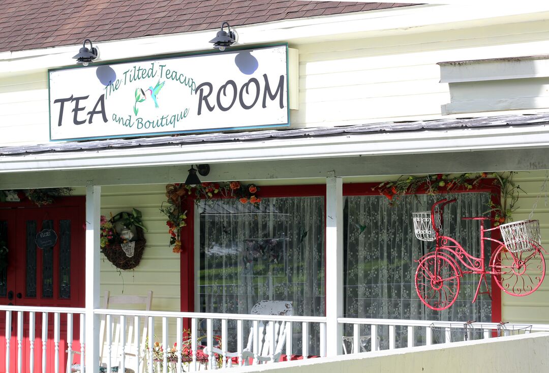Tilted Teacup Side Sign with Bike Decor