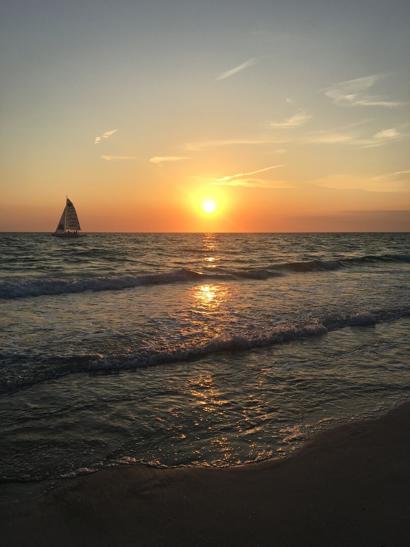 Ocean Sunset with Sail Boat