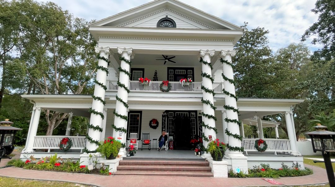 The Treiman House with Karen on porch