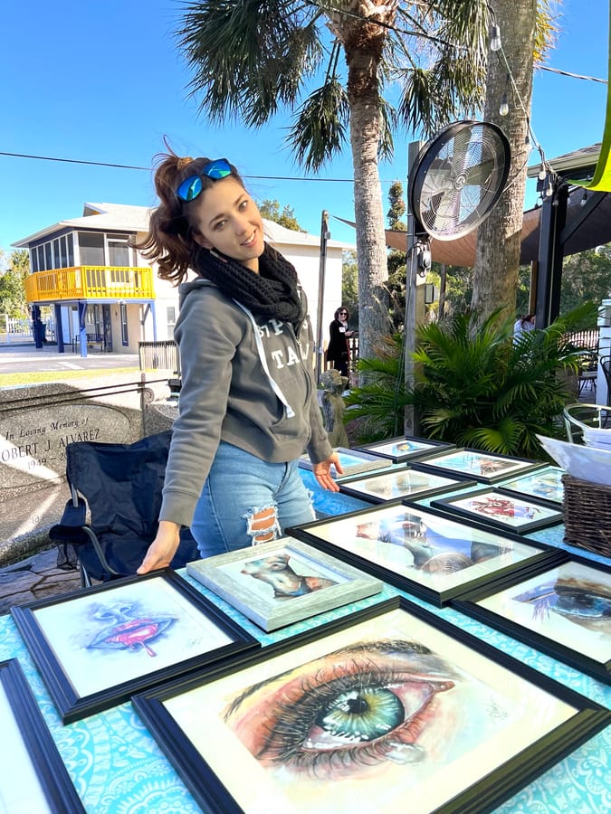 Renata with art on table