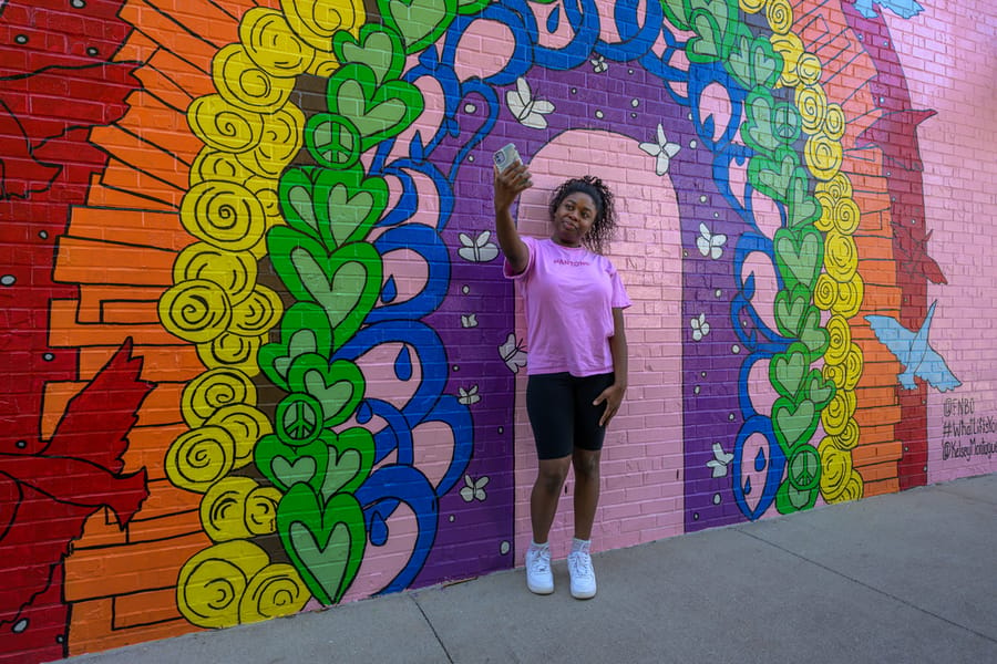 Kindness_Rainbow_Mural_GirlTakingSelfie_June2023